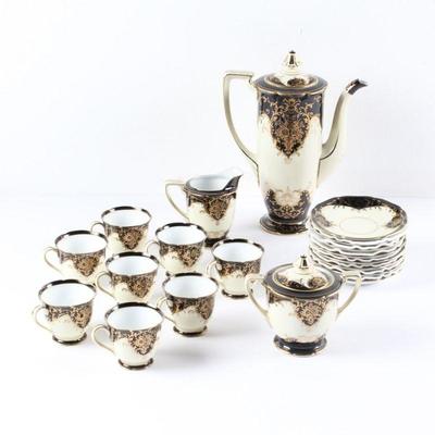 Antique Noritake china demitasse set. This striking china set features an ivory ground, banded upper and lower sections in black, with...