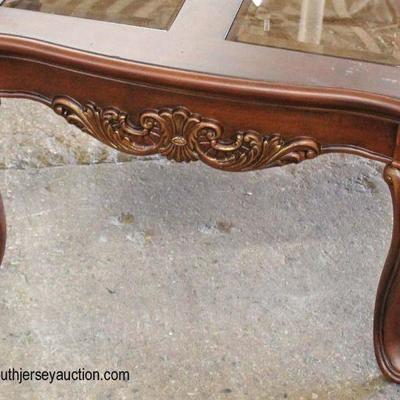 NEW Mahogany Carved Glass Top Coffee Table

Auction Estimate $100-$300 â€“ Located Inside