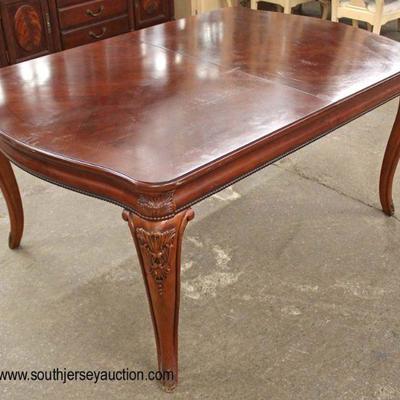  10 Piece Contempoary Carved Mahogany Banded and Inlaid  Dining Room Set

Carved Table with 3 Leaves and Large 4 Door China

Located...
