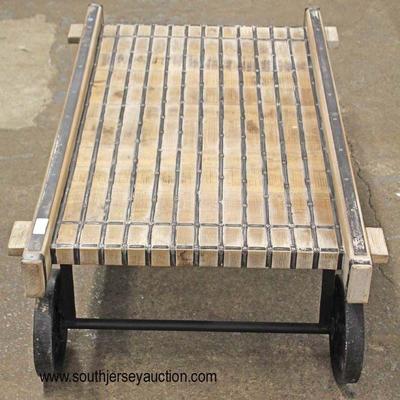 Industrial Style Wood and Iron Coffee Table on Wheels

Auction Estimate $200-$400 â€“ Located Inside

 