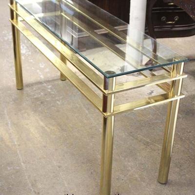 Modern Design Brass and Glass Console Table

Auction Estimate $100-$300 â€“ Located Inside