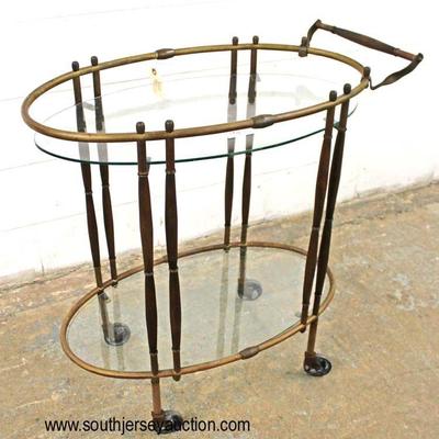 Mid Century Modern 2 Tier Glass and Brass and Danish Walnut Tea Cart

Auction Estimate $200-$400 â€“ Located Inside