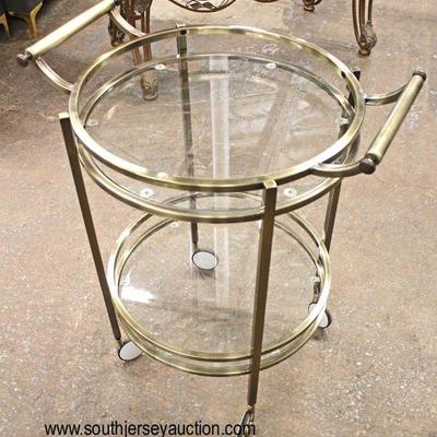 VINTAGE Brass and Glass Round Tea Cart

Auction Estimate $100-$300 â€“ Located Inside