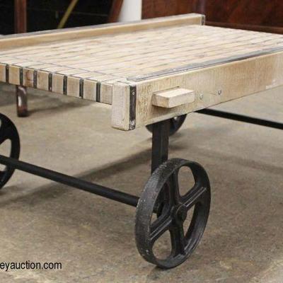 Industrial Style Wood and Iron Coffee Table on Wheels

Auction Estimate $200-$400 â€“ Located Inside

 