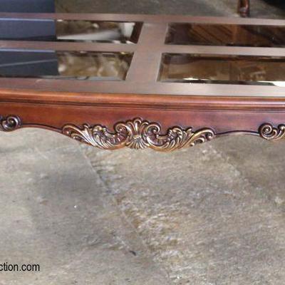 NEW Mahogany Carved Glass Top Coffee Table

Auction Estimate $100-$300 â€“ Located Inside