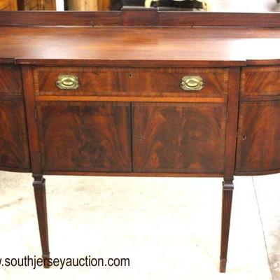  Burl Mahogany â€œBaker Furnitureâ€ Taper Leg â€œDâ€ Shape Sideboard

Auction Estimate $300-$600 â€“ Located Inside 