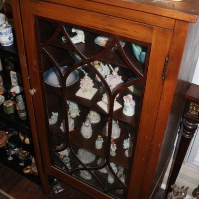 One of MANY curio cabinets