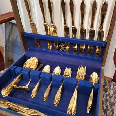 Gold Oneida flatware set
