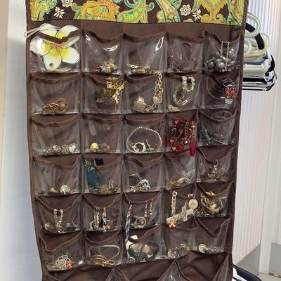 Jewelry and hanging organizer with 33 pockets on each side.