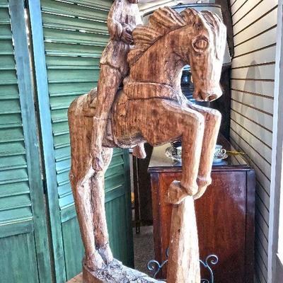 Carved wood of Santo holding a bird while sitting on a horse. This pieces stands almost 3 feet tall. Estate sale price: $500