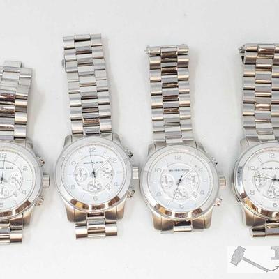 703: 4 Michael Kors Watches
Measures approx 45mm 
