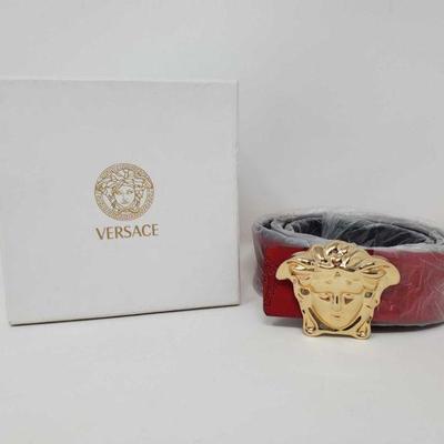 1250: Versace Red Belt with gold Toned Buckle in Box
Model VSV010 Measures approx 47