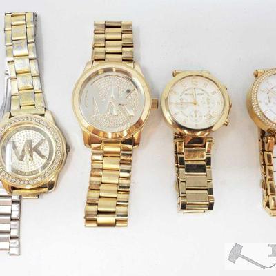 701: 4 Michael Kors Watches
Each watch measures approximately 45mm 