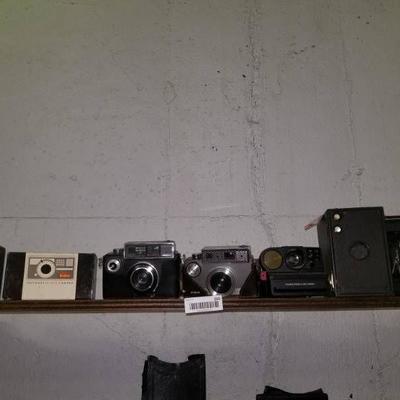 Top center shelf of 7 old cameras- Balda- Kodak- P ...