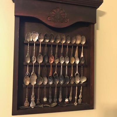 Spoon rack and 33 collection spoons $58