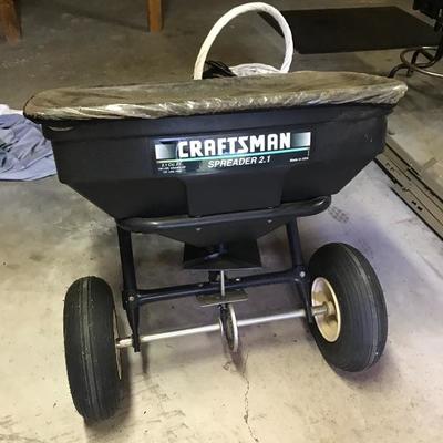 Pull behind spreader