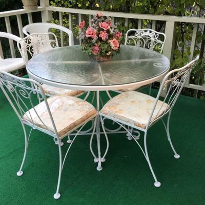Iron Patio/Bistro Table and 4 chairs, Plastic Patio chairs.