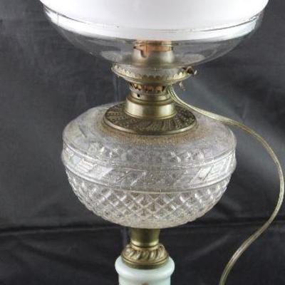 Antique oil lamp with hand painted base patterned glass font milk glass globe on clear glass vase with electrical added