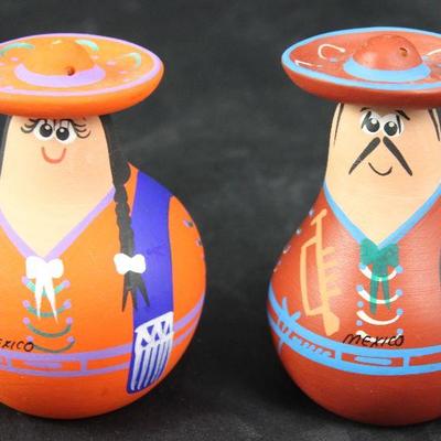 Terra-cotta hand painted salt and pepper shakers made in Mexico