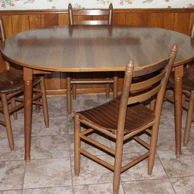 Vintage maple Formica topped round table with Leaf 42â€ x 52â€ shown with ladder back slat bottom chairs 4 each