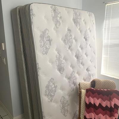 Queen mattress set with metal frame.