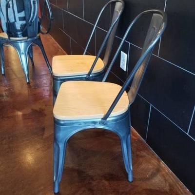 (2) Gray Metal Restaurant Chairs.