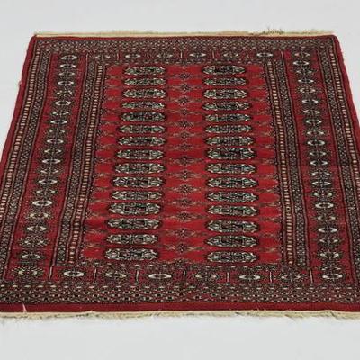 5' x 3' Hand-knotted Wool Boukhara rug with centering rows of repeating blue and white guls on a red ground, 61.5
