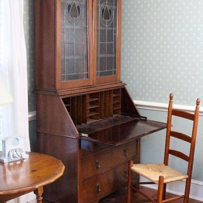 secretary with bookcase, ladderback chair, round table