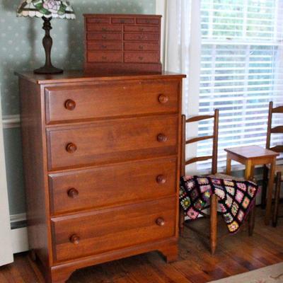 chest of drawers, leaded glass lamp, jewelry chest, pair of ladder back chairs, small table, crocheted lap blanket