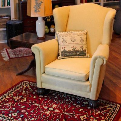 wing chair with hand-made rug, drop leaf side table with drawer