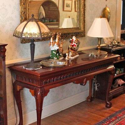 hall table, gold framed mirror, porcelain Santa, sleigh, & reindeer, vintage gold-trimmed glass serving platters, cast metal &...