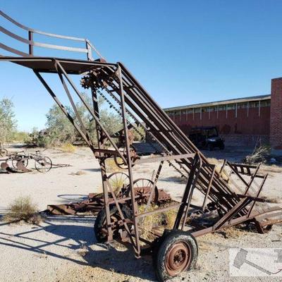 2004: Antique Hay Elevator Trailer
Single axle, elevator rotates off speed of wheels. No chain attached. Approx 8 1/2 feet tall and 16ft...