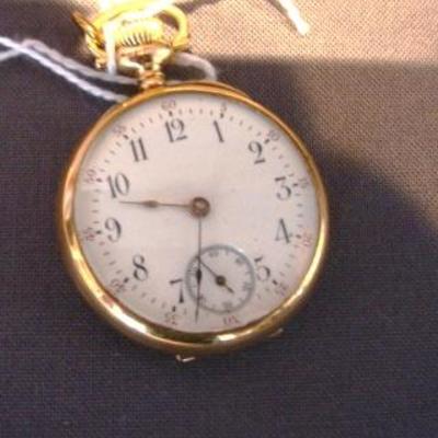 14K gold ladies pendant watch , open face, 15 jewels, total weight 17.0
dwt