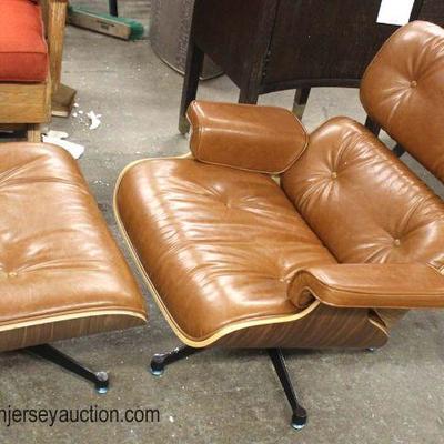NEW 2 Piece Grayson PU Lounge Chair and Ottoman in the Walnut Veneer in the Distressed Camel Leather
Located Inside â€“ Auction Estimate...