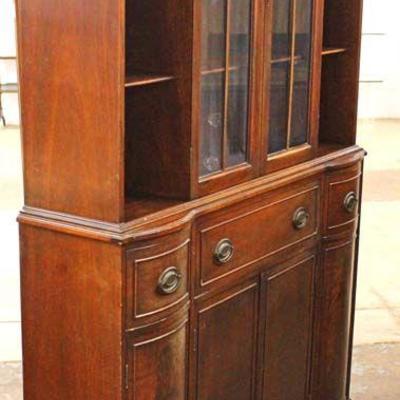  Burl Mahogany â€œMaddox Furnitureâ€ 6 Door 2 Drawer China Cabinet Breakfront with Desk and Bookcase Sides

Auction Estimate $300-$600...