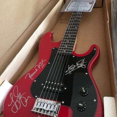 Guitar Autographed by Rolling Stones! Includes signatures of Mick Jagger, Keith Richards, Ronnie Wood, and Charlie Watts. S101 Guitar. COA