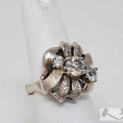 105: 14k Gold Plated Diamond Ring, 8.1g
Weighs approx 8.1g, adjustable band - sizes 6-10 Center Diamond is approx .75ct Marked 