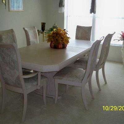 Light Wood Table with 6 Chairs and 2 Leaf.