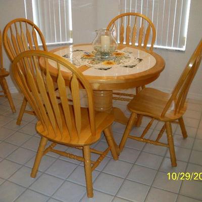 Wood Tile Top Table with 6 chairs and 1 leaf.