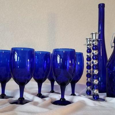 Cobalt blue wine glasses, candlesticks and vase