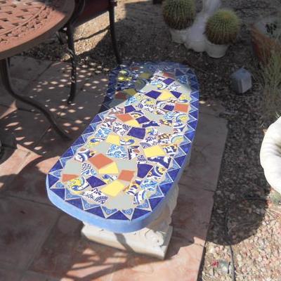 solid bench with mexican tile