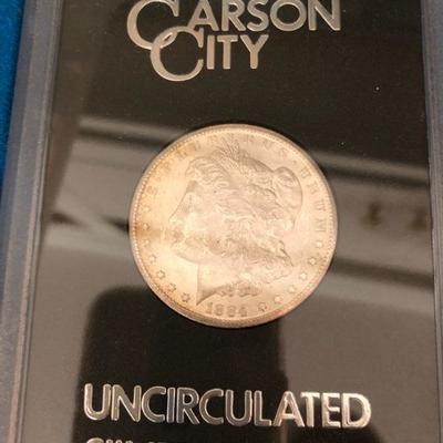The 1884 Morgan CC (Carson City) Silver Dollar - Uncirculated. Each coin comes with serial number, case & box.