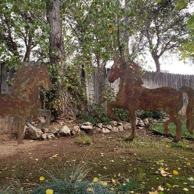 Pair of 6 ft cut metal horses.