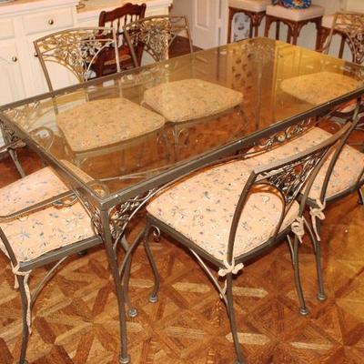 Glass top metal legged table with six chairs