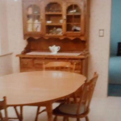  kitchen table includes six chairs and a beautiful hutch.  both for $500 or best offer. Will separate. 