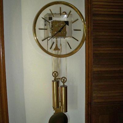 Vintage Lucite Wall Clock by George Nelson for Howard Miller, this is an 8 day key wind pendulum wall clock with chime.