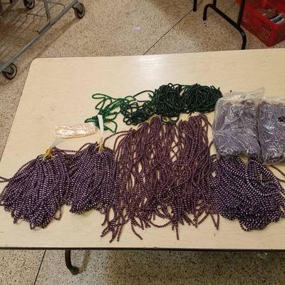 large lot of purple and green beaded strands