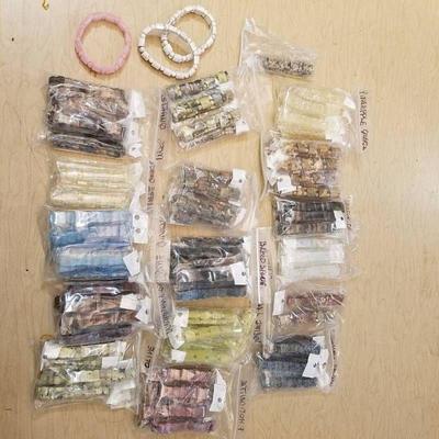 approximately 100 assorted bracelets