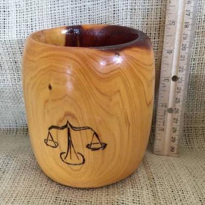 Handmade wood cup with the scales of justice
