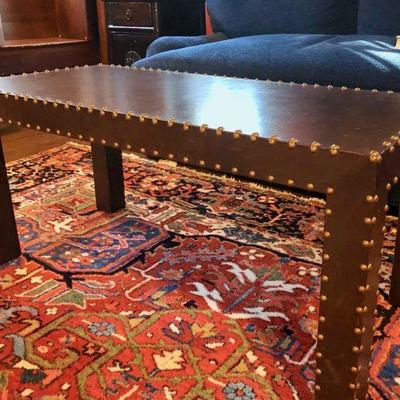 Leather wrapped coffee table with nailhead trim